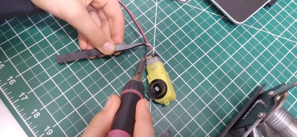 Heating the wires for soldering.